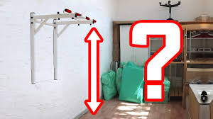 На какой высоте вешать турник?